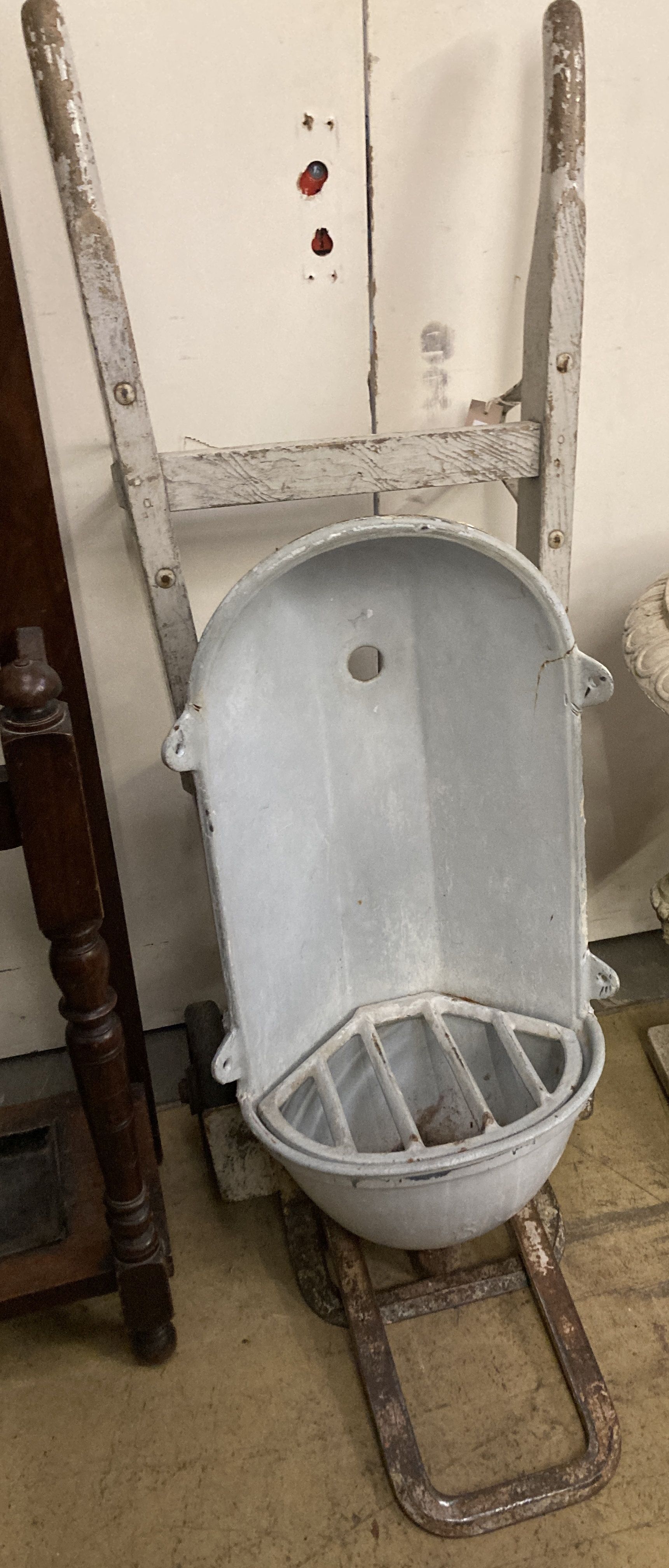 A vintage sack barrow together with a water fountain